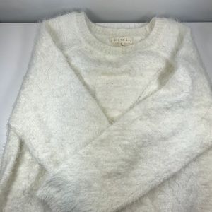 This is a white sweater fit for fall.